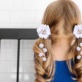 OAOLEER bow clipped into toddler pigtails, tidy look for school and play
