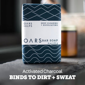 Oars + Alps bar in hand demonstrating compact travel-friendly size