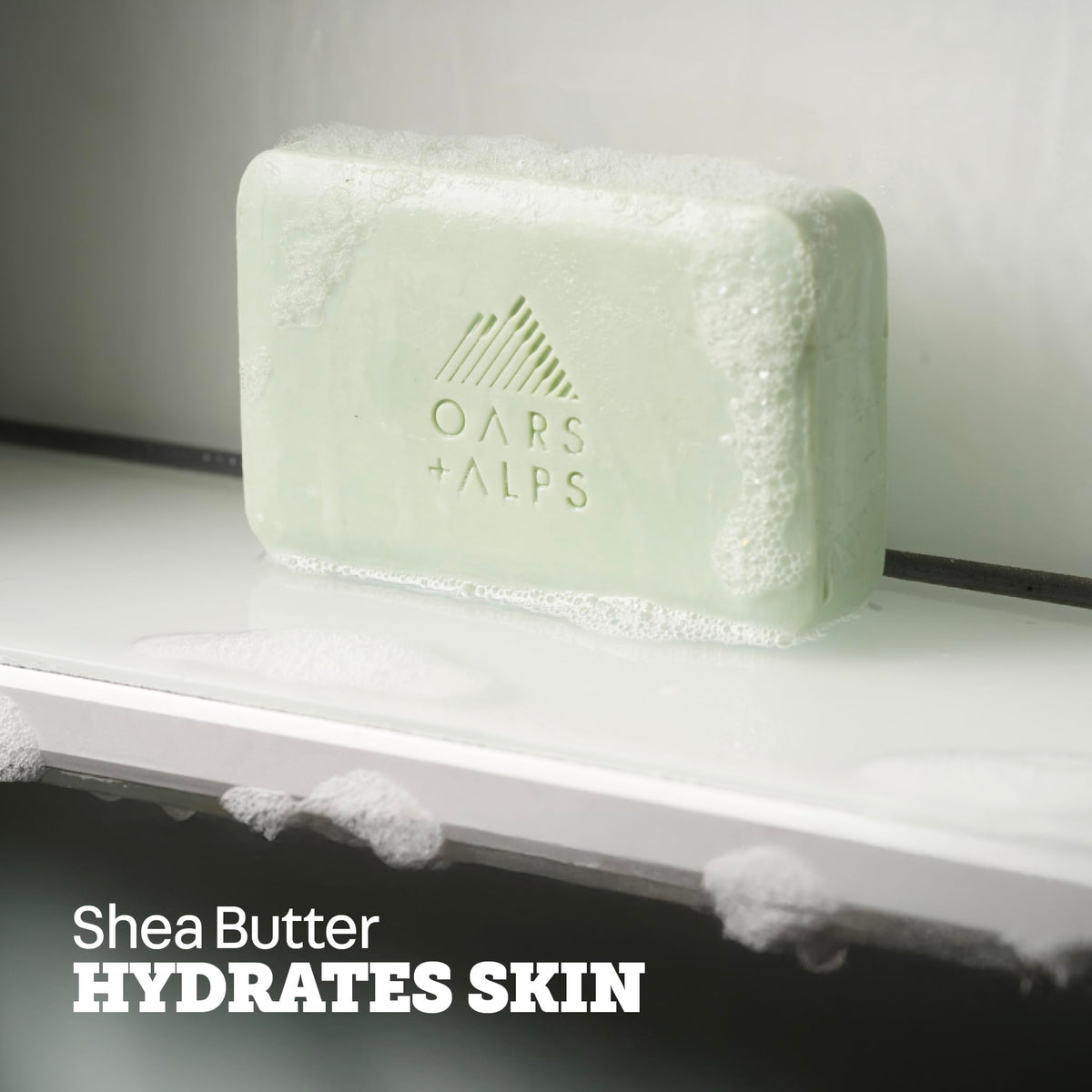 Oars + Alps rich lather on hand demonstrating cleansing and moisturizing benefit