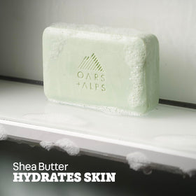 Oars + Alps rich lather on hand demonstrating cleansing and moisturizing benefit