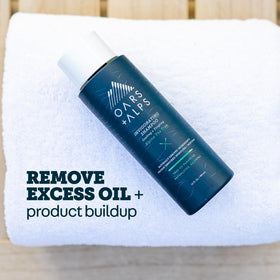 Oars + Alps shampoo pouring from bottle to show consistency and ease