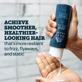 Oars + Alps shampoo lather texture demonstrating gentle sulfate-free cleanse