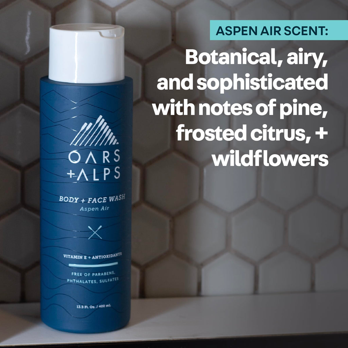 Oars + Alps bottle in hand for scale showing compact size and travel-friendly benefit