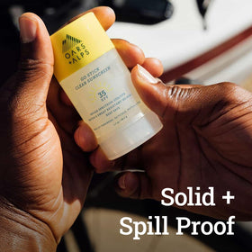 Oars + Alps sunscreen stick used at the beach showing water-resistant protection