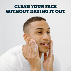 Applying Oars + Alps gel to damp hands demonstrating gentle lathering benefit