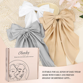 obeoby hairstyle with bow in ponytail demonstrating polished everyday styling