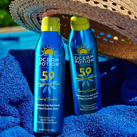 Ocean Potion bottle on a beach towel for active outdoor protection