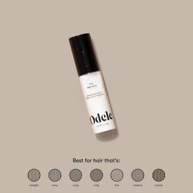 Odele dry shampoo applied from hand to roots demonstrating easy on-the-go use