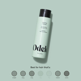 Odele shampoo lather in hand demonstrating gentle foam and moisturizing effect