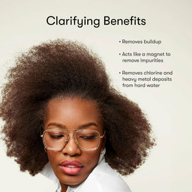 Odele shampoo in hand showing bottle size and travel-friendly benefit