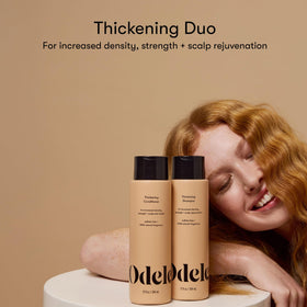 Close-up of Odele shampoo pump dispensing product illustrating easy application benefit