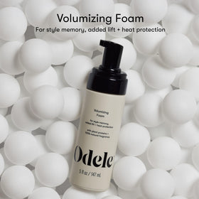 Odele foam texture close-up on fingertip, demonstrating airy hold