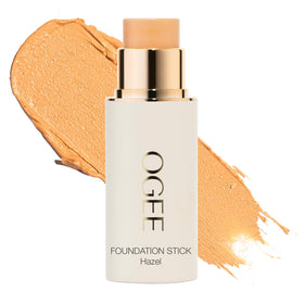 Ogee foundation stick front view showing compact full-coverage design and natural finish