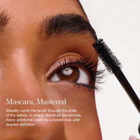 Ogee mascara held in hand illustrating compact size for easy travel and control