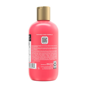 OGX product placed on bathroom shelf in lifestyle scene suggesting routine use