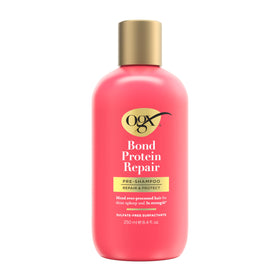 OGX bottle front packaging showing brand and repair benefits for hair restoration