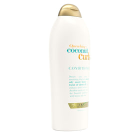 OGX applying conditioner into curly hair to detangle and hydrate