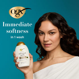 OGX held in hand for scale showing two 13 fl oz bottles and travel-friendly size