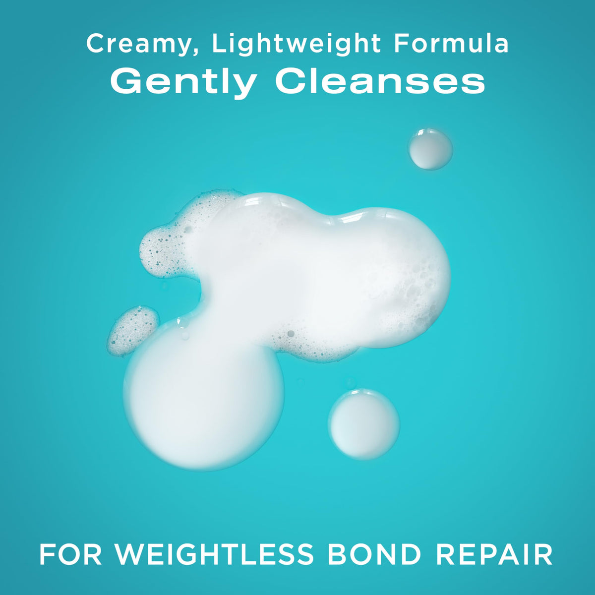 OGX conditioner creamy texture on fingertips showing smooth slip for detangling