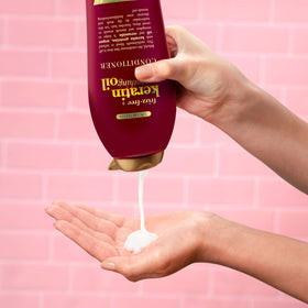 OGX label showing keratin argan oil ceramides for smoother hair