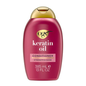 OGX bottle front view showing keratin oil conditioner and strengthening benefit