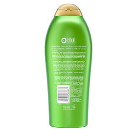 OGX bottle beside rosemary and mint sprigs illustrating natural extracts