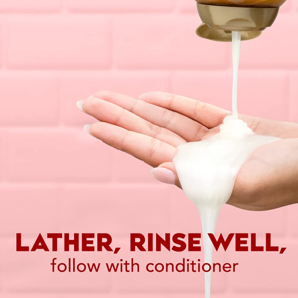 OGX applying shampoo to wet hair demonstrating improved manageability benefit