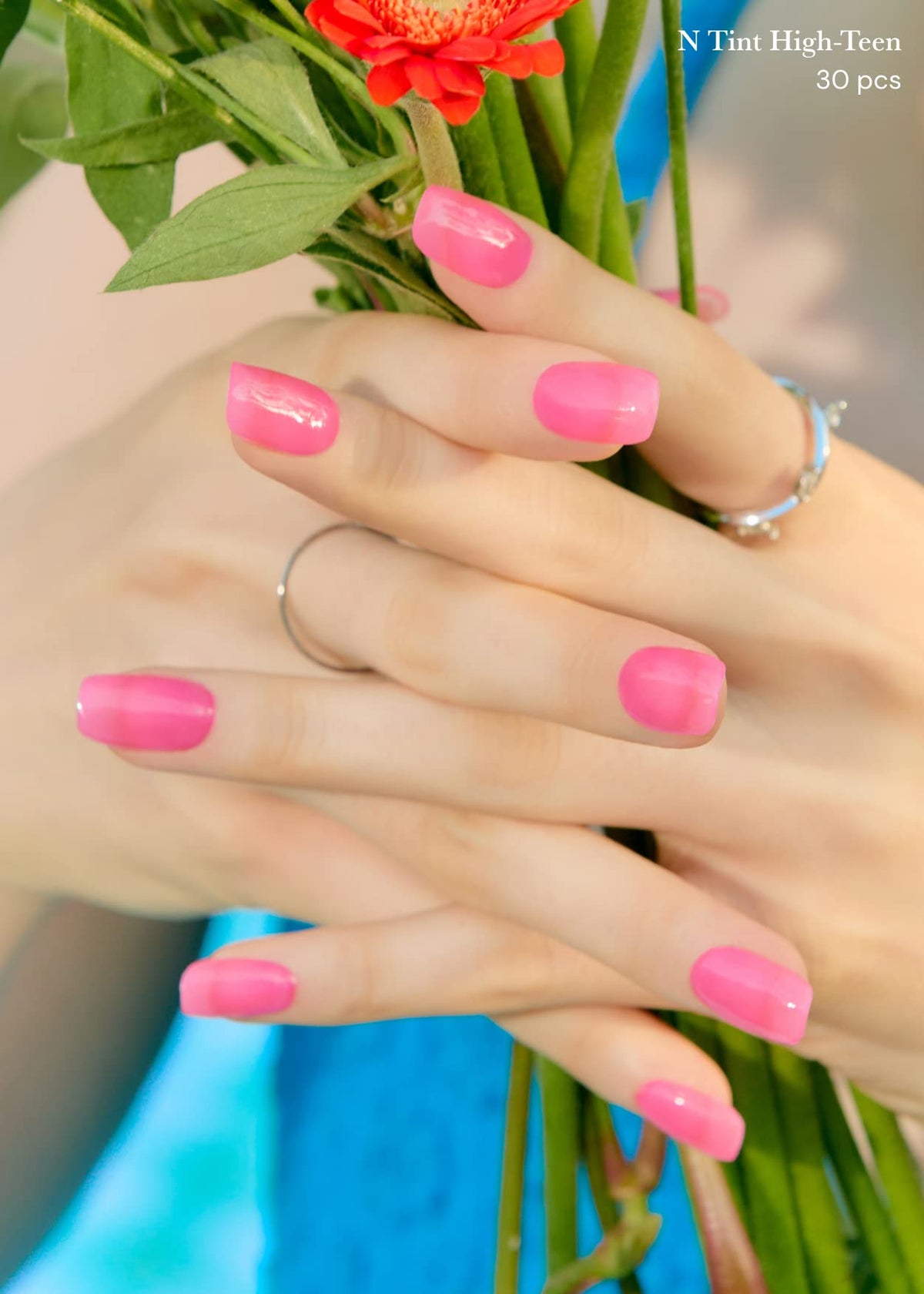 ohora hand wearing finished N Tint High-Teen pink gel strips demonstrating salon shine