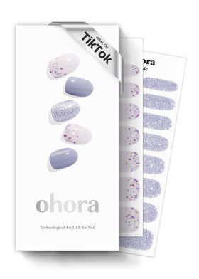 ohora front packaging showing blue glitter design and included tools for quick salon look