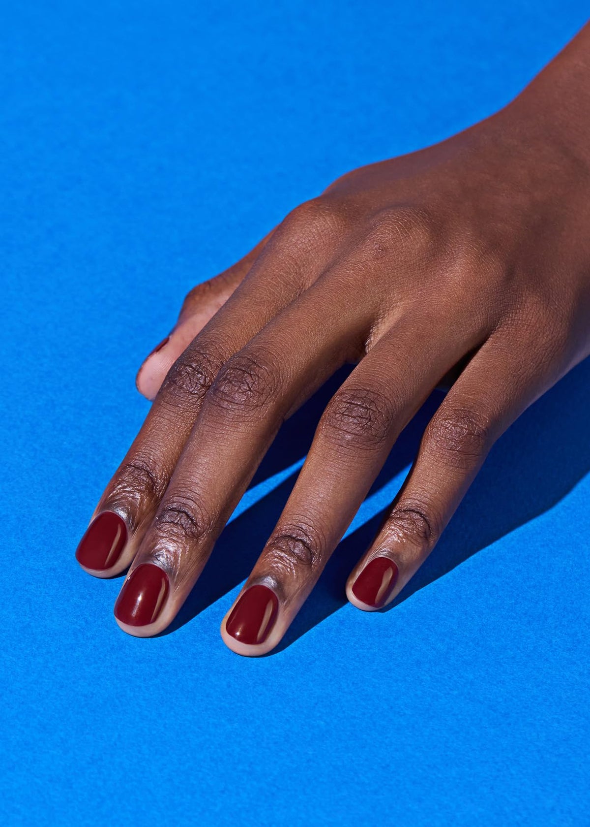 ohora strips on fingers before curing demonstrating simple adhesion process