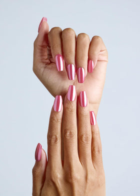 ohora on model hand lifestyle shot showing pink chrome nails and polished glossy benefit