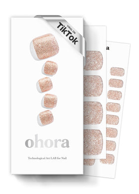 ohora box front view showing nude glitter pedi strips and included tools for quick pedicure
