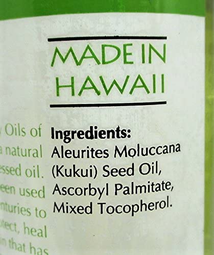 Oils of Aloha warmed oil on hands ready for scalp treatment soothing dryness