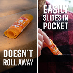 O'Keeffe's stick held in hand to show size and easy pocket-friendly benefit