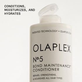 Olaplex Nº.5 cream consistency on hand demonstrating richness and slip
