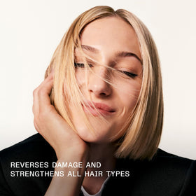 Olaplex No.3 being applied to damp hair demonstrating even distribution and improved detangling