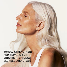 Close-up purple shampoo foam texture to show concentrated pigment and creamy hydration