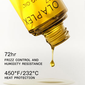drop of Olaplex No.7 oil on black background showing lightweight texture and shine