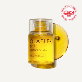 Olaplex No.7 bottle top and pipette close-up demonstrating precise application