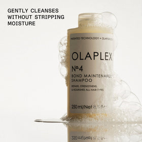 Olaplex bottle next to conditioner illustrating system pairing benefits