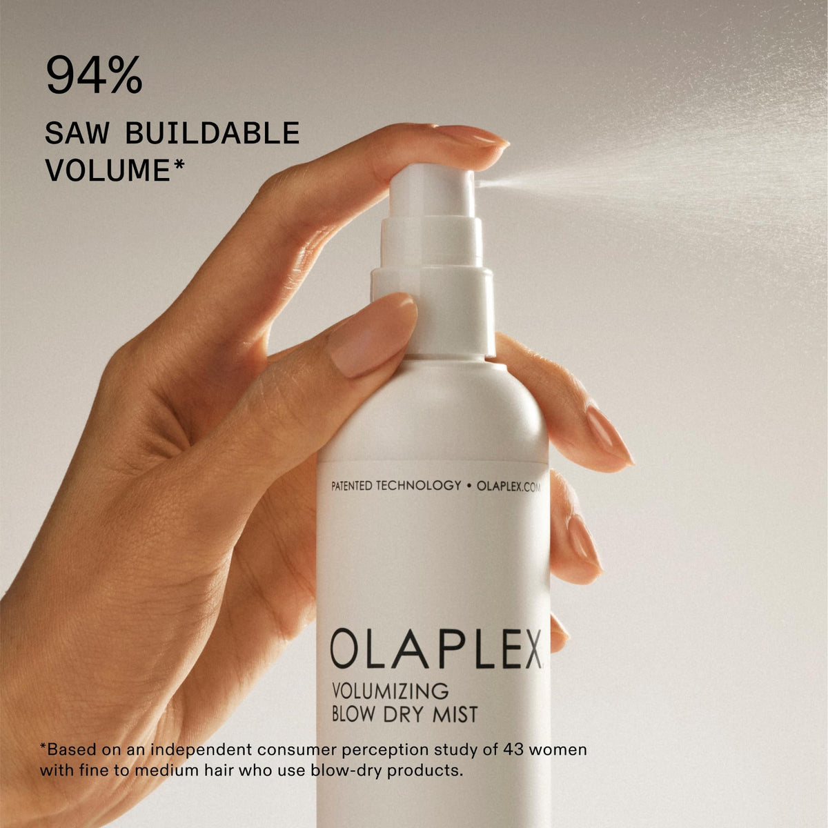 Olaplex bottle held in hand showing product size and travel-friendly benefit