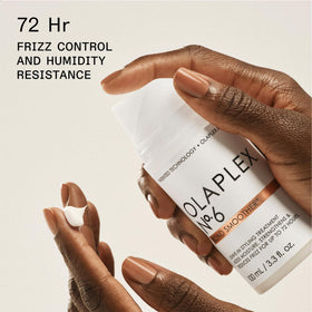 Olaplex travel bottles in hand showing compact size and easy portability