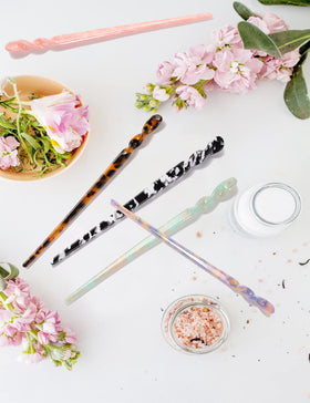 Olawyrae hair stick beside ruler showing 6.88-inch length for leverage and support in styling