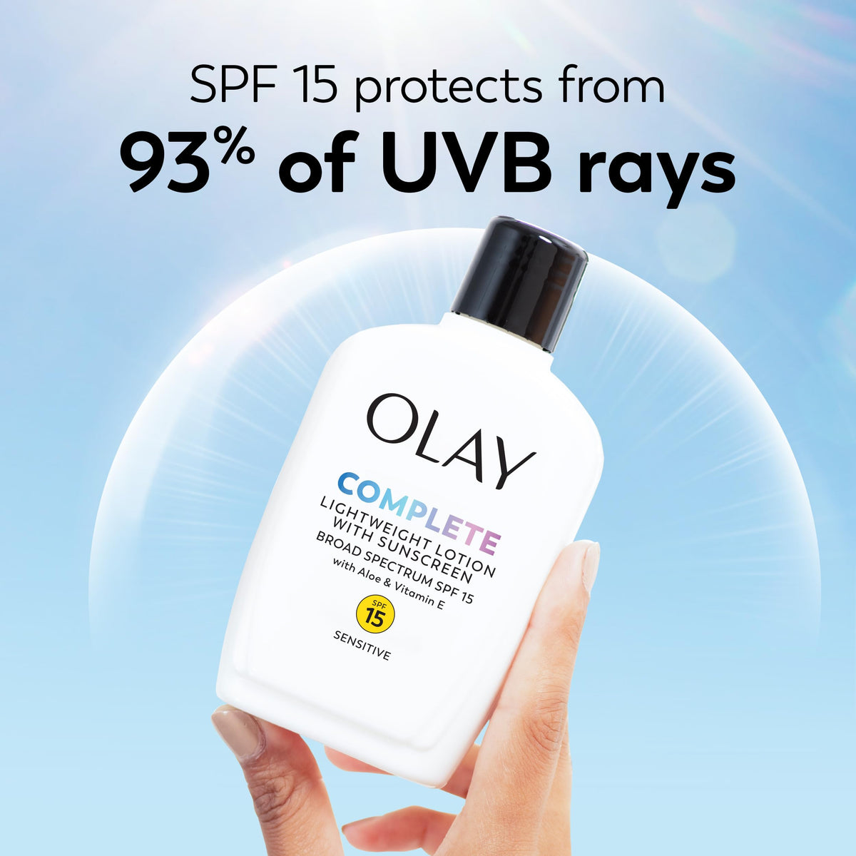 Procter & Gamble Olay Complete bottle in hand for size and scale convenience