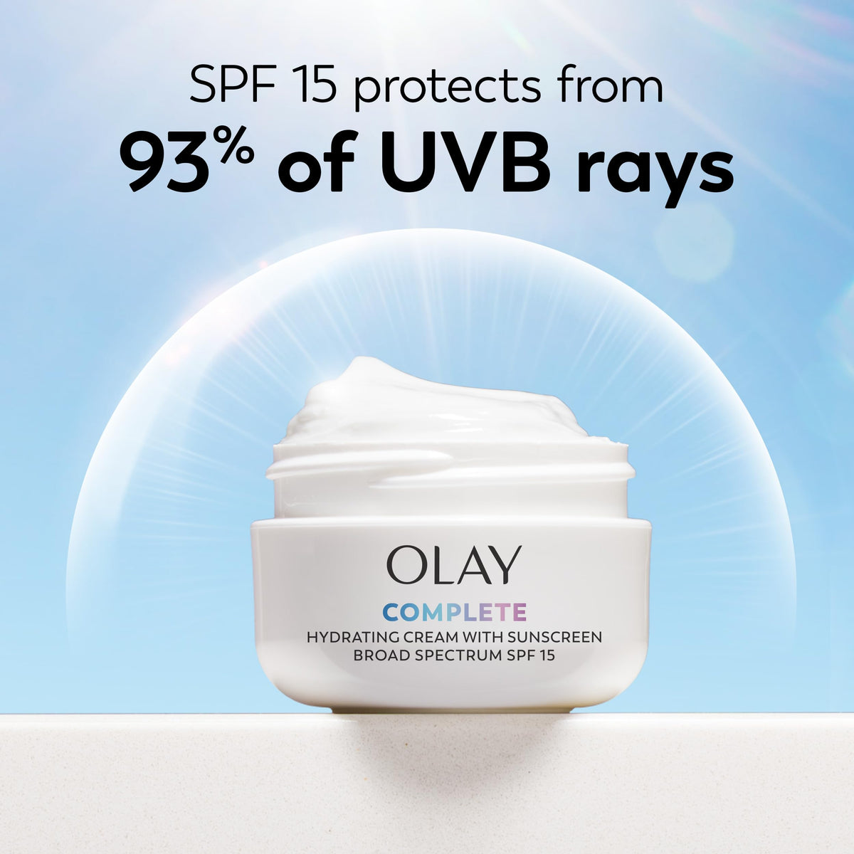 Olay tube beside common items for size comparison and portability