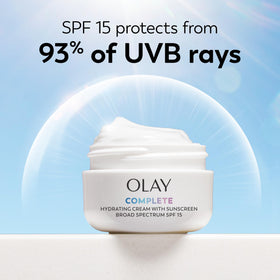 Olay tube beside common items for size comparison and portability