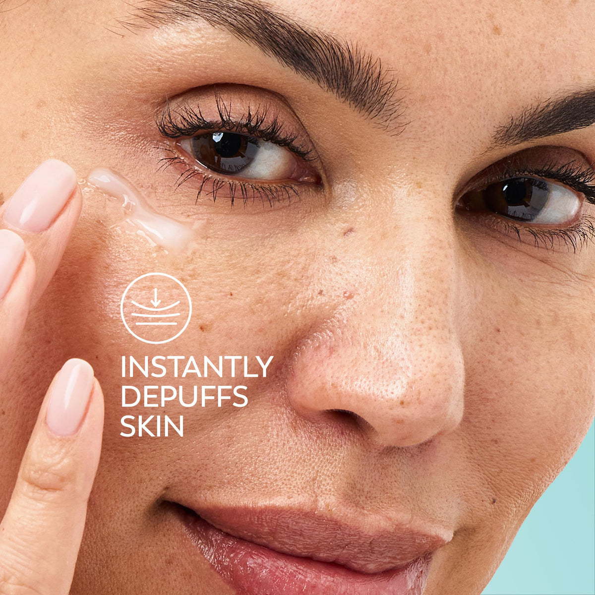 Olay eye cream applied under eye illustrating refreshing hydration