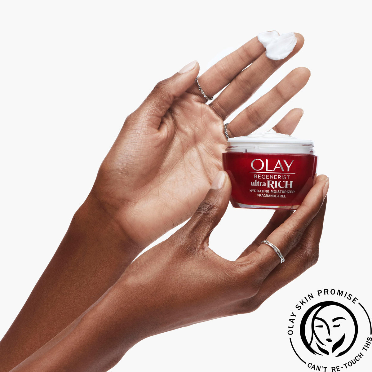 Olay being smoothed onto cheek, showing hydration and non-greasy finish