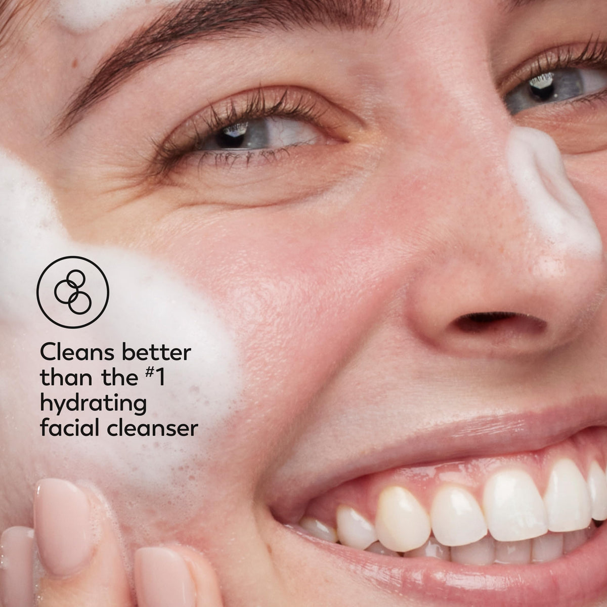Olay removing makeup from face to show efficient SPF and makeup removal