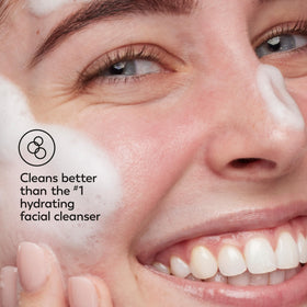 Olay removing makeup from face to show efficient SPF and makeup removal